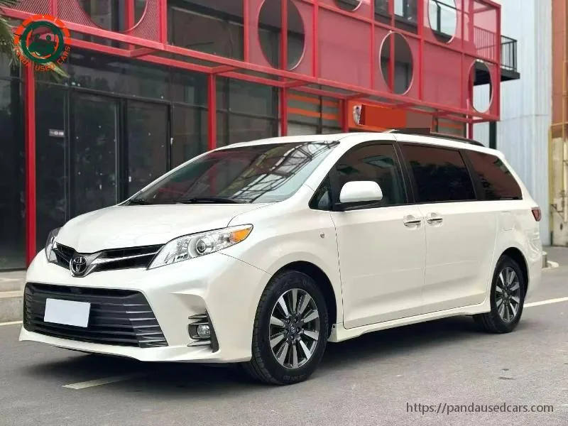 Earlier-generation white Toyota Sienna